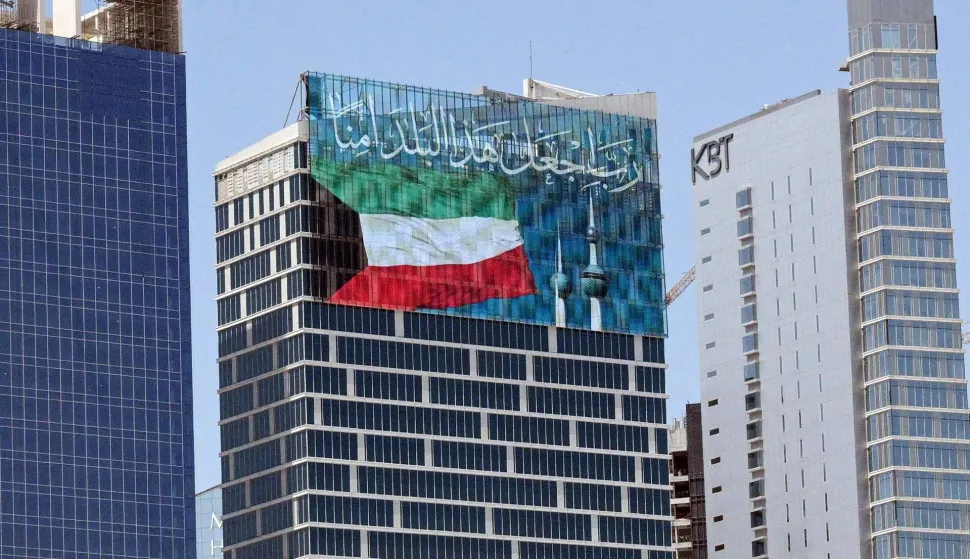 A large screen displays a verse from the Koran reading "My Lord, make this city secure," alongside the Kuwaiti flag and the landmark Kuwait Towers, on a skyscraper in Kuwait City on September 2, 2026. Iran launched a wave of attacks on US sites across the Middle East on September 2, as violence surged after an extensive American bombardment and the deaths of four people at an Iranian wedding party. Iran's Revolutionary Guards announced attacks on US bases in Jordan, the UAE, Kuwait, Bahrain and Iraq's autonomous Kurdistan region, in the six-month conflict's heaviest exchange in weeks. (Photo by AFP)/