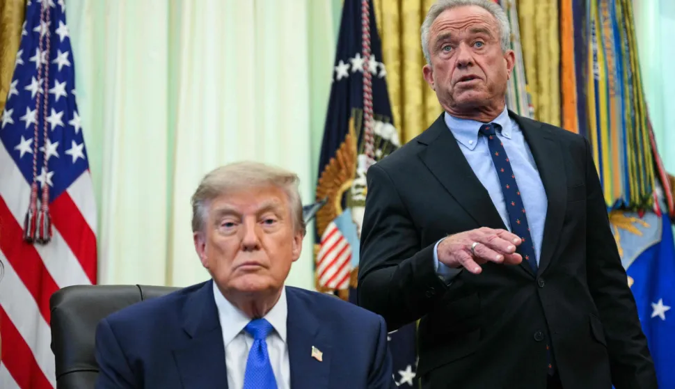 US Secretary of Health and Human Services Robert F. Kennedy Jr. (R) speaks before President Donald Trump signs an executive order calling for more research and flexibility on vaccines, in the Oval Office of the White House in Washington, DC, on August 10, 2026. (Photo by Jim WATSON/AFP)