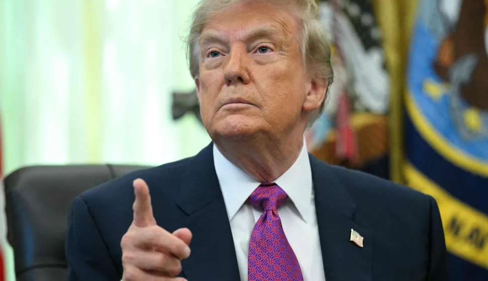 US President Donald Trump speaks after signing an executive order that aims to rename Lake Ontario to Lake America in the Oval Office of the White House in Washington, DC, on August 27, 2026. President Donald Trump announced Thursday that he is renaming Lake Ontario -- a large body of water shared by the United States and Canada -- "Lake America." Trump signed an order in the White House, telling reporters the change was "effective immediately." (Photo by Jim WATSON/AFP)