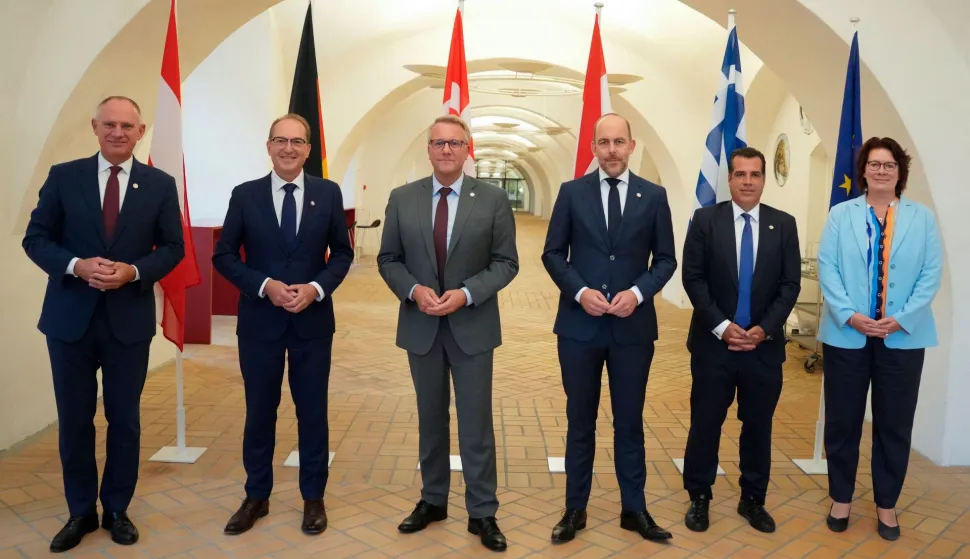 Denmark's Minister for Immigration and Integration Morten Boedskov (3L), Netherlands' Minister for Asylum and Migration and Deputy Prime Minister Bart van den Brink (3R), Germany's Minister of the Interior Alexander Dobrindt (2L), Austria's Minister of the Interior Gerhard Karner (L),Greece's Minister for Asylum and Migration Thanos Plevris (2R) and EU Director-General for Migration and Home Affairs Beate Gminder pose for a family photo after the meeting of the Ministers for Immigration and Integration from the Five Country Group in Copenhagen, Denmark, on September 4, 2026. (Photo by Liselotte Sabroe/Ritzau Scanpix/AFP)/Denmark OUT