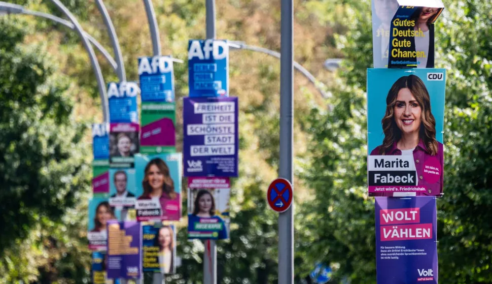 Placards in Berlin taken on August 18, 2026 feature election campaign ads for, amongst aother parties, the Christian Democratic Union (CDU), the Alternative for Germany (AfD) and Volt, for upcoming regional elections in Berlin, to be held on September 20, 2026. (Photo by John MACDOUGALL/AFP)