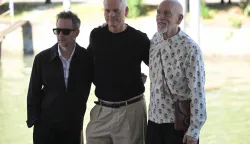 US actor Sam Rockwell, director Martin McDonagh and US actor John Malkovich arrive for the photocall and the presser of "Wild Horse Nine" at the 83rd International Venice Film Festival, at Venice Lido on September 3, 2026. (Photo by Tiziana FABI/AFP)