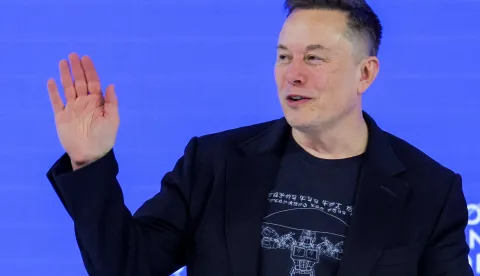 FILE PHOTO: Elon Musk waves to the crowd during the 56th annual World Economic Forum (WEF) meeting in Davos, Switzerland, January 22, 2026. REUTERS/Denis Balibouse/File Photo Photo: DENIS BALIBOUSE/REUTERS