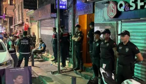 This handout photograph taken and released on September 13, 2026 by Turkish news agency DHA (Demiroren News Agency) shows Turkish police standing outside a night club during a Police raid as part of the " My family is safe" operation in Istanbul. Turkish police on September 13, 2026 made a slew of arrests in raids on gay bars and the homes of LGBTQ activists, authorities and one organisation targeted said. "As part of the 'My Family is Safe' operations... carried out in collaboration with our police and gendarmerie forces, legal proceedings have been initiated against 162 suspects, 9 organisations and 13 companies in&nbsp;... a total of 15 provinces," including Istanbul and Ankara, justice minister Akin Gurlek posted on X. (Photo by Handout/DHA (Demiroren News Agency)/AFP)/Turkey OUT/RESTRICTED TO EDITORIAL USE - MANDATORY CREDIT "AFP PHOTO/DHA (Demiroren News Agency) " - NO MARKETING NO ADVERTISING CAMPAIGNS - DISTRIBUTED AS A SERVICE TO CLIENTS