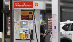 A driver fills his vehicle up with gas in Los Angeles, California on September 8, 2026. Oil prices climbed to near 0 a barrel in Asian morning trade, as the flare-up threatened to further choke supply from the crude-rich Middle East. (Photo by Frederic J. BROWN/AFP)