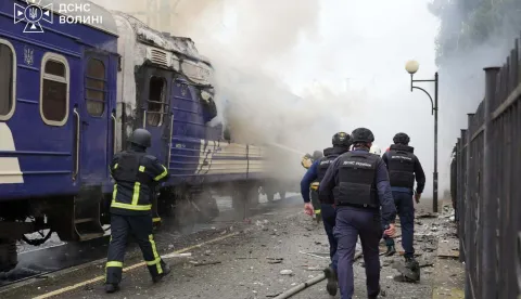This handout picture taken and released by the Ukrainian State Emergency Service on September 12, 2026 shows firefighters extinguish fire at a train carriage damaged by a drone strike near the border with Poland. Poland and Ukraine condemned on September 13, 2026 an escalation following Russian strikes in Ukraine close to the Polish border, which notably targeted a train bound for Warsaw, which come just a week after visits by US envoys to Moscow and Kyiv aimed at reviving Washington-led negotiations to end the conflict. (Photo by Handout/Ukrainian State Emergency Service/AFP)