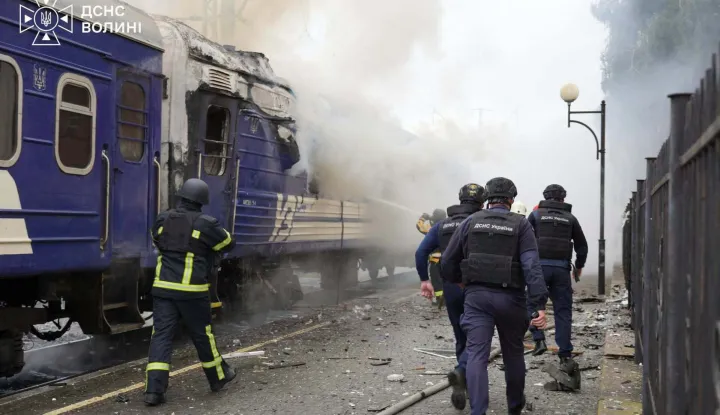 This handout picture taken and released by the Ukrainian State Emergency Service on September 12, 2026 shows firefighters extinguish fire at a train carriage damaged by a drone strike near the border with Poland. Poland and Ukraine condemned on September 13, 2026 an escalation following Russian strikes in Ukraine close to the Polish border, which notably targeted a train bound for Warsaw, which come just a week after visits by US envoys to Moscow and Kyiv aimed at reviving Washington-led negotiations to end the conflict. (Photo by Handout/Ukrainian State Emergency Service/AFP)