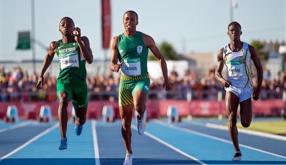 epa07097236 A handout photo made available by OIS/IOC of (L-R) Nigeria's Olukunle Alaba Akintola, South Africa's Luke Davids, and Mali's Issa Sangare in action during the men's 100m heats at the Athletics events of the Youth Olympic Games in Buenos Aires, Argentina, 15 October 2018 (issued 16 October 2018). Davids won the gold medal in the 100m final. EPA/FLORIAN EISELE for OIS/IOC HANDOUT HANDOUT EDITORIAL USE ONLY/NO SALES