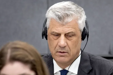 (FILES) Former Kosovo president Hashim Thaci sits in court as he appears on charges of war crimes before the Kosovo Tribunal in The Hague on April 3, 2023. Kosovo's former president Hashim Thaci was found guilty of war crimes and jailed for 25 years by a tribunal in the Hague on September 16, 2026, the court said in a long-awaited verdict likely to spark outrage in the Balkan country. The judges said Thaci, who was tried along with three other former guerrilla leaders, was guilty of illegal arrests, torture, murder and cruel treatment. Thaci is considered a hero by many in Kosovo, who have been eagerly awaiting the verdict after a three-year trial. (Photo by Koen van Weel/ANP/AFP)/Netherlands OUT