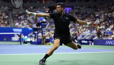 NEW YORK, NEW YORK - AUGUST 30: Novak Djokovic of Serbia returns a shot in his match against Mariano Navone of Argentina during their Men's Singles First Round match on Day One of the 2026 US Open at USTA Billie Jean King National Tennis Center on August 30, 2026 in the Flushing neighborhood of the Queens borough of New York City. Julian Finney/Getty Images/AFP (Photo by JULIAN FINNEY/GETTY IMAGES NORTH AMERICA/Getty Images via AFP)