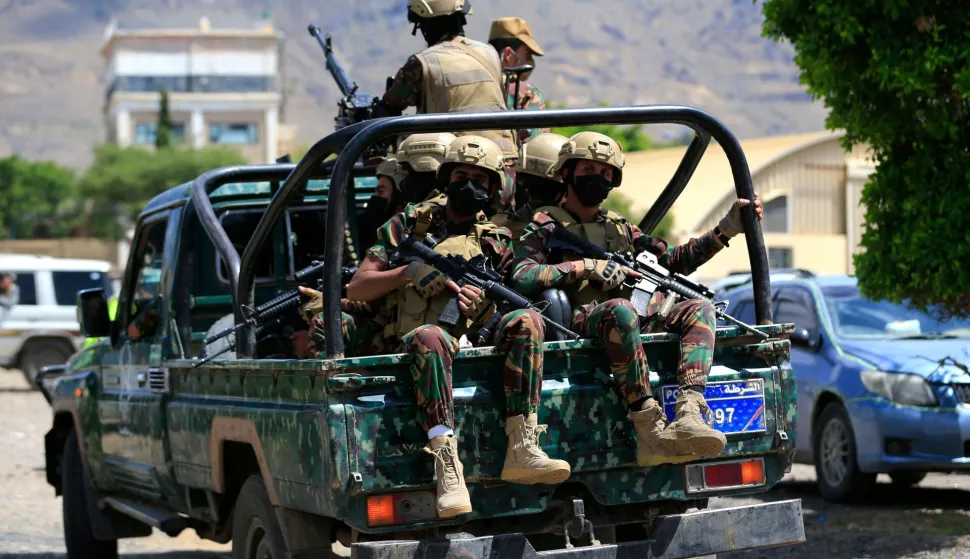 Yemen's Houthi armed forces patrol as Yemeni prisoners loyal to the Houthi authorities arrive in the capital Sanaa on September 12, 2026, after being released on the west coast where he and others were being held by Yemen's Saudi-backed government forces. Some 210 prisoners were released following a week-long offensive, in which the Iran-backed Houthis on September 11, 2026, captured Yemen's Red Sea coast from the internationally recognised government, cementing their hold on the Bab al-Mandab Strait, a vital artery for Saudi Arabian oil exports as the Strait of Hormuz remains closed amid the US-Iran war. (Photo by Mohammed HUWAIS/AFP)HUTISTI, JEMEN