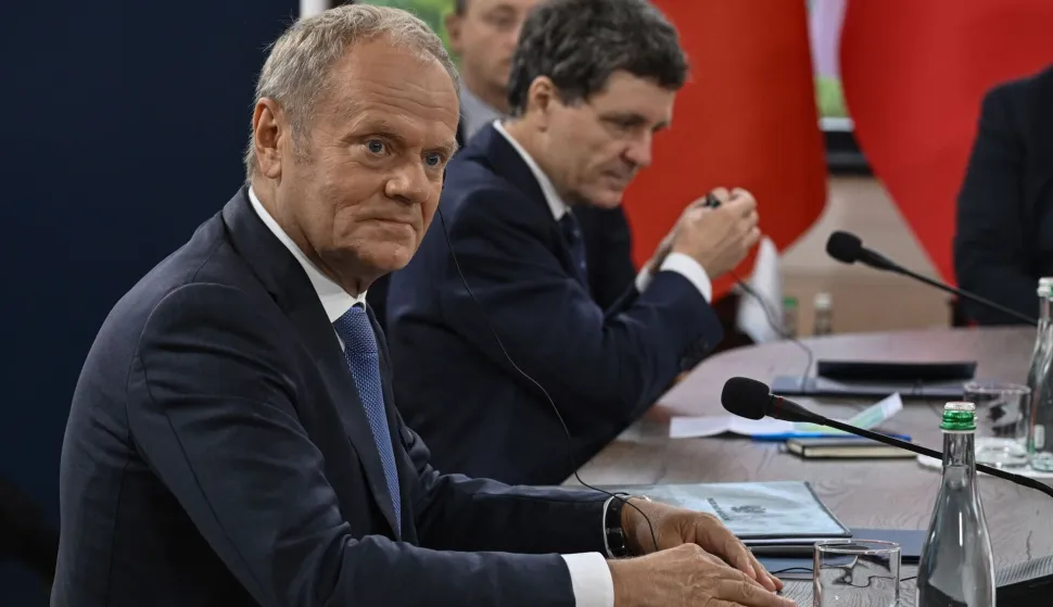 Poland's Prime Minister Donald Tusk (L) attends the Carpathian 8 summit in the state residence in Ivano-Frankivsk region on September 18, 2026, amid the Russian invasion of Ukraine. (Photo by Genya SAVILOV/AFP)