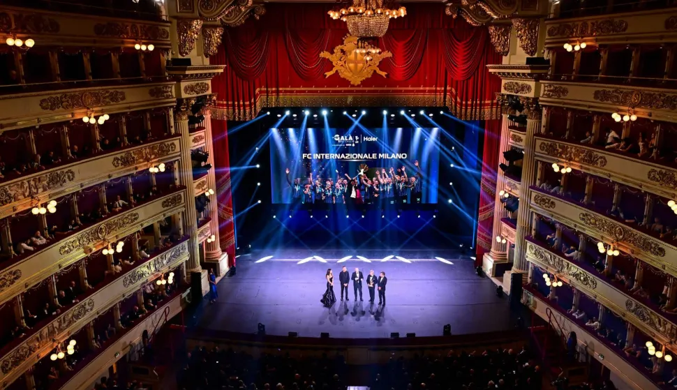 Inter Milan's Sport CEO, Giuseppe Marotta, poses on stage after receiving the award for Best Team of the Year alongside Country Manager for Haier Italy, Emiliano Garofalo, and President of Lega Serie A, Ezio Simonelli, during the Italian Footballers' Association (AIC) Gala and awards Ceremony at La Scala Theatre in Milan, Italy on September 2, 2026. (Photo by Piero CRUCIATTI/AFP)