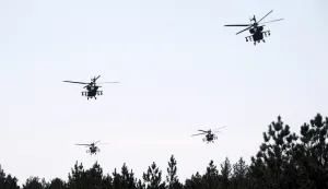 epa12069452 US Army's AH-64D Apache attack helicopters conduct aerial gunnery training at Adazi Military training ground in Latvia, 02 May 2025. During the training, the final stage of the regular certification process also took place which will certify that Apache helicopter crews are capable of conducting combat operations, firing and neutralizing various types of targets &ETH; stationary and moving. EPA/VALDA KALNINA