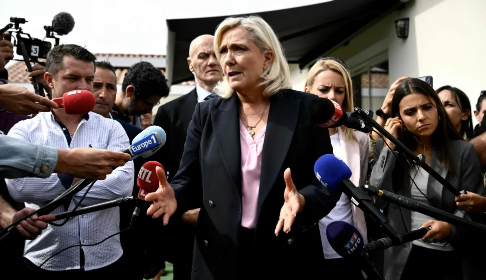 President of the far-right Rassemblement National (RN) parliamentary group and 2027 French presidential candidate Marine Le Pen speaks to the press during her visit to Le Porge, south-western France, on September 17, 2026, months after a wildfire destroyed some 183 homes in the town as part of a broader blaze that swept through the Gironde department this summer. (Photo by Philippe LOPEZ/AFP)