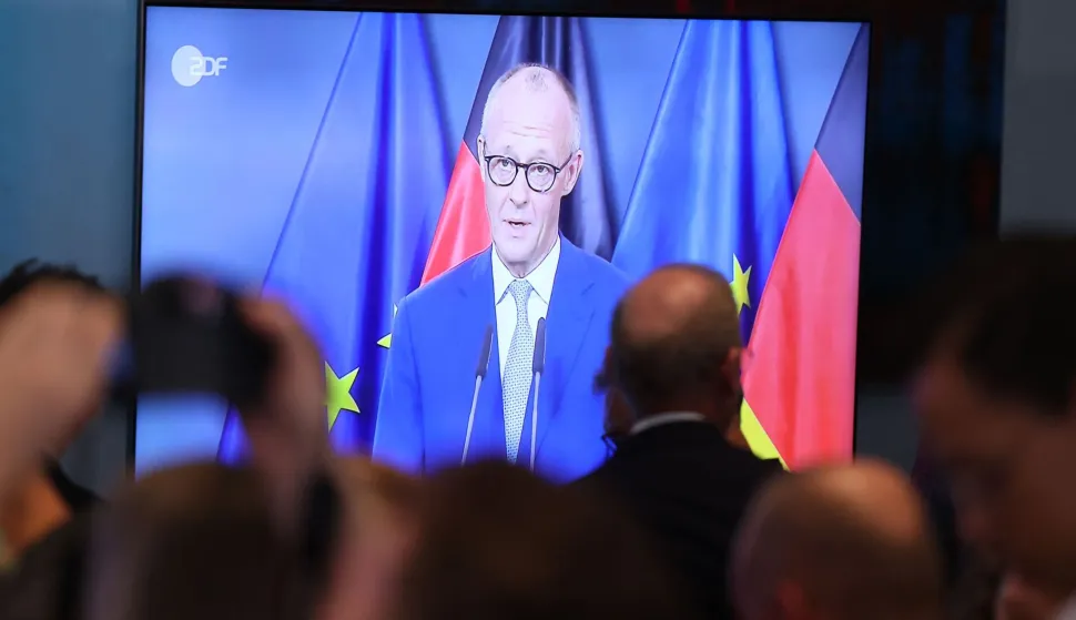 CDU members watch German Chancellor and leader of Germany's Christian Democratic Union (CDU) Friedrich Merz delivering a statement after the exit polls of regional state elections in Berlin and Mecklenburg-Western-Pomerania's in Berlin on September 20, 2026. (Photo by Odd ANDERSEN/AFP)