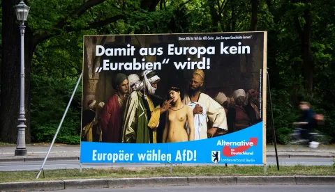 epa07532645 An election campaign poster for the European Parliament elections of the Berlin chapter of the right-wing Alternative fuer Deutschland (AfD) party, showing the artwork 'The Slave Market' (1866) of French painter Jean-Leon Gerome, subscribed with the slogans 'Europeans vote AfD!' and 'for Europe will not become 'Eurabia'!' stands in a central part in Berlin, Germany, 27 April 2019. The Massachusetts-based Clark Art Institute, who owns the painting, condemned the use on Twitter and pointed out, that they didn't supply it to the AfD. News reports state, the institute asked the AfD to stop using the painting for their aims. EPA/CLEMENS BILAN