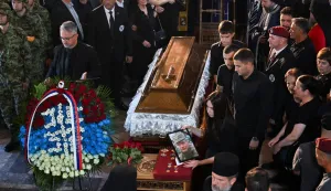 Darko Mladic (L), son of late Bosnian Serb military leader Ratko Mladic stands next to the coffin of his father during the funeral ceremony for Ratko Mladic at St Lukas church in Belgrade on September 7, 2026. Mladic, 84, died last week after suffering several strokes while serving a life sentence in The Hague for war crimes committed during the 1990s war in Bosnia. (Photo by OLIVER BUNIC/AFP)
