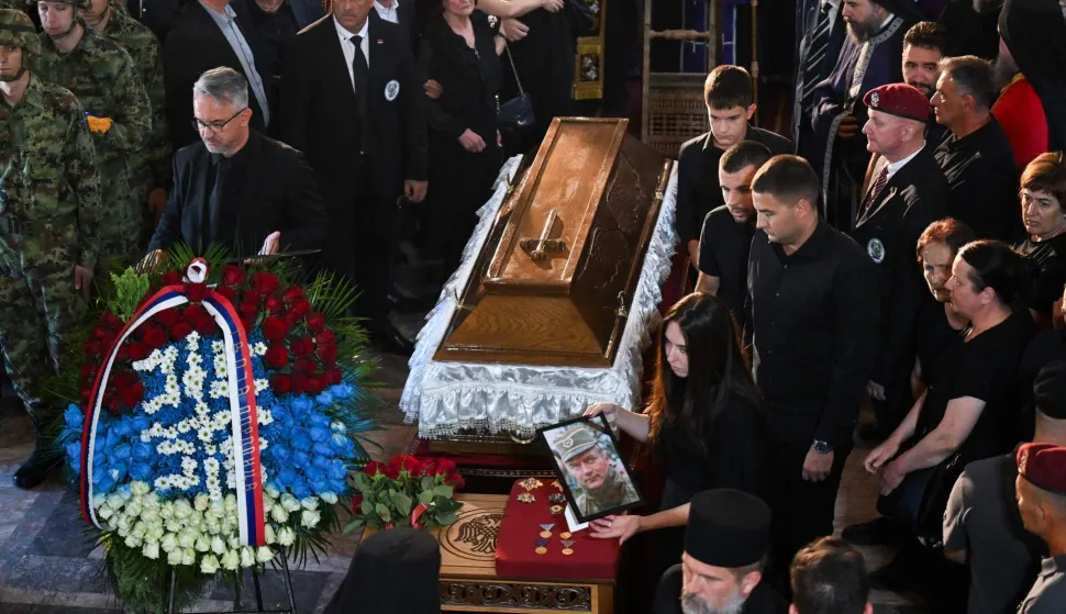 Darko Mladic (L), son of late Bosnian Serb military leader Ratko Mladic stands next to the coffin of his father during the funeral ceremony for Ratko Mladic at St Lukas church in Belgrade on September 7, 2026. Mladic, 84, died last week after suffering several strokes while serving a life sentence in The Hague for war crimes committed during the 1990s war in Bosnia. (Photo by OLIVER BUNIC/AFP)