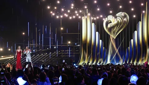 Austrian presenters Victoria Swarovski and Michael Ostrowski arrive on stage for a dress rehearsal for the first semi-final of the Eurovision Song Contest 2026 (ESC) at Wiener Stadthalle in Vienna, Austria on May 11, 2026. (Photo by Tobias SCHWARZ/AFP)