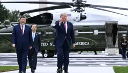 US President Donald Trump walks with China's President Xi Jinping after showing him the new helipad on the South Lawn of the White House after their bilateral meeting, in Washington, DC, on September 24, 2026. President Xi is on a State visit to the United States from September 23 to 25. (Photo by Brendan SMIALOWSKI/AFP)