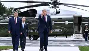 US President Donald Trump walks with China's President Xi Jinping after showing him the new helipad on the South Lawn of the White House after their bilateral meeting, in Washington, DC, on September 24, 2026. President Xi is on a State visit to the United States from September 23 to 25. (Photo by Brendan SMIALOWSKI/AFP)