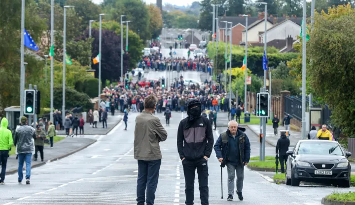 Protesters continue to block the Garvaghy Road in Portadown, Northern Ireland on September 27, 2026, preventing a parade of marchers from the Orange Order using the route through the mainly nationalist area of the town. A parade by Northern Ireland's pro-British Protestant Orange Order was set to pass through a mainly Catholic and nationalist area on Sunday for the first time since 1997, after an overnight court ruling cleared it to proceed. The confrontation is known as the Drumcree dispute after the church attended by the marchers. (Photo by Paul Faith/AFP)