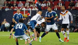 Greece's defender #04 Ntinos Mavropanos is tackled by Germany's defender #04 Jonathan Tah during the UEFA Nations League Group A2 between Germany and Greece in Augsburg, southern Germany on September 27, 2026. (Photo by Michaela STACHE/AFP)