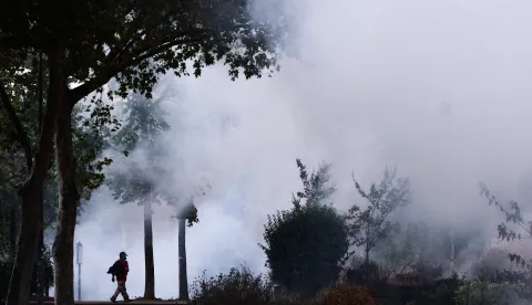Teargas fills a park during ongoing student protest action and scuffles with police, in Lyon, central eastern France, on October 1, 2026. Since late September, students have staged protests outside schools over grievances ranging from timetables, class sizes and a shortage of teachers to overheated classrooms during this year's heatwaves. The protests started in the Ile-de-France region around Paris but have now spread to other cities nationwide. (Photo by Alex MARTIN/AFP)