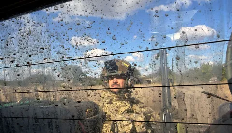 A serviceman of Ukraine's 141st Separate Mechanised Brigade rides on a pick up vehicle in Malomykhaylivka village in Dnipropetrovsk region on October 2, 2026, amid the Russian invasion of Ukraine. (Photo by Darya Nazarova (STR Zaporizhzhia)/AFP)
