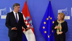 epa08549638 President of the European Commision Ursula von der Leyen (R) welcomes Croatian Prime Minister Andrej Plenkovic (L) before their bilateral meeting at the EU headquarters in Brussels, Belgium, 16 July 2020. EPA/JOHN THYS/POOL
