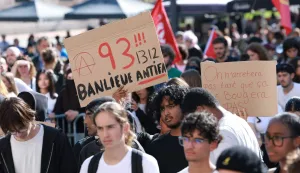 high school students hold a placard which reads as '"93 (93, suburb antifascist 1312" (1312 being the numeric code for the the abbreviation ACAB, a slogan for All Cops are Bastards), during a gathering amid a nationwide protest movement over school conditions in Saint-Denis, north of Paris, on October 4, 2026. Up to 500 schools across France will be totally or partly closed on October 5 due to the protests by teenage pupils that have shaken the country. movement. The teens at French high schools, known as lyc?es, say that their studies are being ruined by high teacher absences, overlong school days and dilapidated facilities as well as other grievances. (Photo by Kenzo TRIBOUILLARD/AFP)