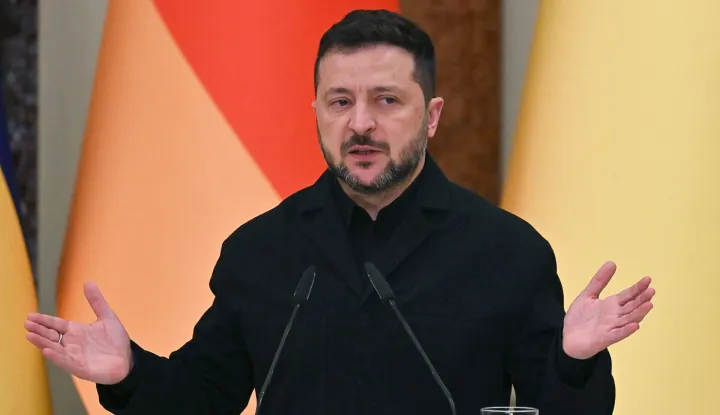 Ukraine's President Volodymyr Zelensky speaks during a press conference following talks with Germany's Chancellor in Mariinsky Palace following talks in Kyiv on October 4, 2026, amid the Russian invasion of Ukraine. (Photo by Sergei SUPINSKY/AFP)