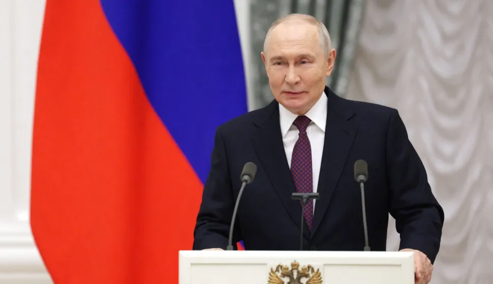 In this pool photograph distributed by the Russian state agency Sputnik, Russia's President Vladimir Putin hosts a ceremony to present state awards to mentors and teachers of participants in Russia's military action in Ukraine, at the Kremlin in Moscow on October 5, 2026. (Photo by Gavriil Grigorov/POOL/AFP)