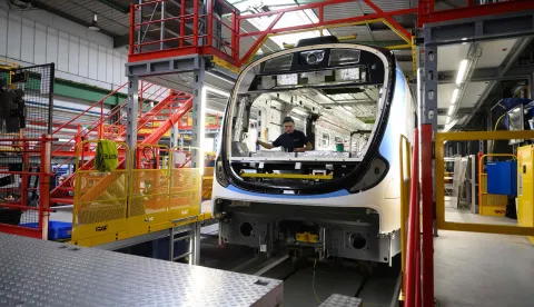 An employee works on a CAF (Construcciones y Auxiliar de Ferrocarriles) Mi20 (future RER B) train during a press visit to the Spanish railway manufacturer's factory in Reichshoffen, eastern France, on September 29, 2026. (Photo by SEBASTIEN BOZON/AFP)
