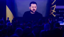 Participants listen as Ukraine's President Volodymyr Zelensky speaks via videolink during the opening session of the Warsaw Security Forum in Warsaw, Poland on October 12, 2026. (Photo by Wojtek RADWANSKI/AFP)