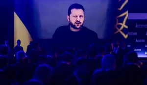 Participants listen as Ukraine's President Volodymyr Zelensky speaks via videolink during the opening session of the Warsaw Security Forum in Warsaw, Poland on October 12, 2026. (Photo by Wojtek RADWANSKI/AFP)