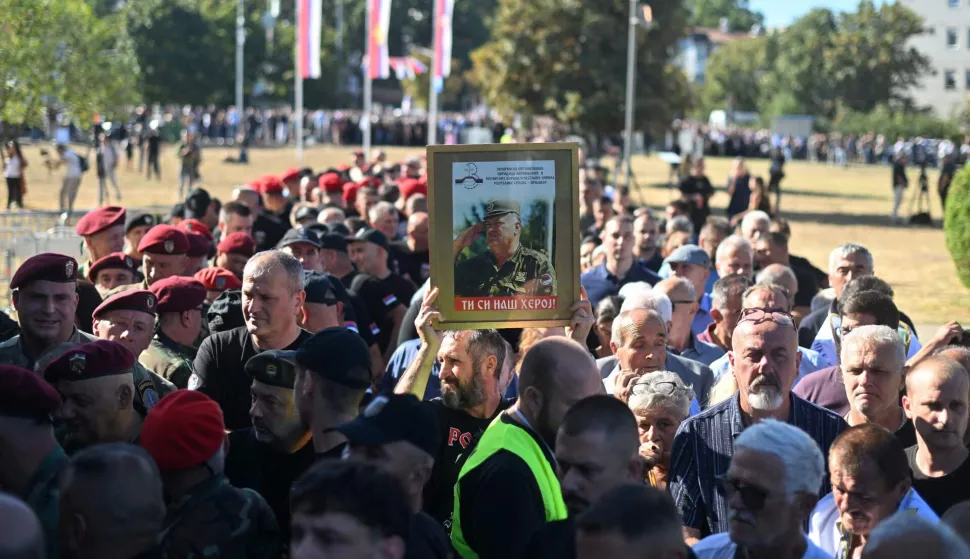 Mourners, holding a portrait of late Bosnian Serb military leader Ratko Mladic, queue as they arrive to take part in a public memorial on the day of his funeral ceremony at St Lukas church in Belgrade, on September 7, 2026. Mladic, 84, died last week after suffering several strokes while serving a life sentence in The Hague for war crimes committed during the 1990s war in Bosnia. (Photo by OLIVER BUNIC/AFP)