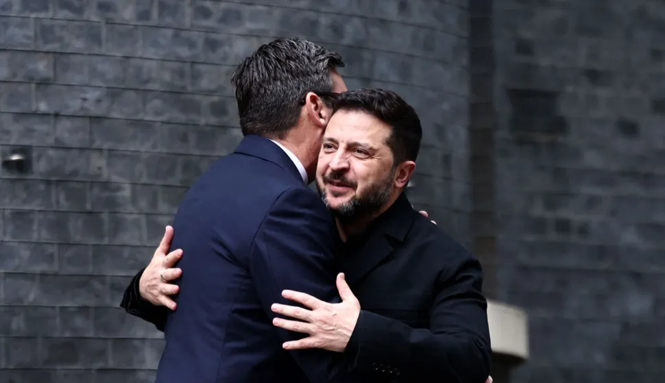 Britain's Prime Minister Andy Burnham (L) greets Ukraine's President Volodymyr Zelensky on the steps of 10 Downing Street, in central London, on October 14, 2026, ahead of their meeting. (Photo by Henry Nicholls/POOL/AFP)