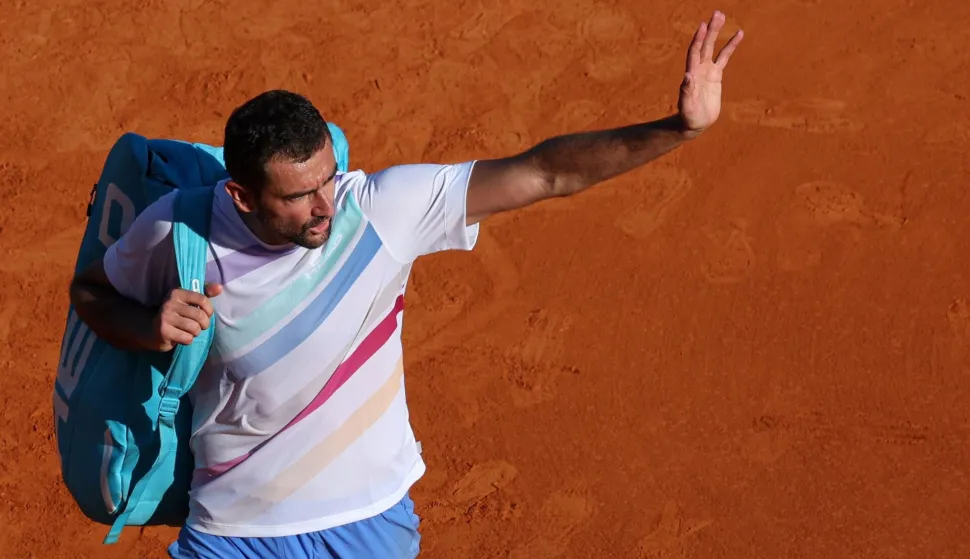 Croatia's Marin Cilic waves as he leaves the Court Rainier III after playing against Canada's Felix Auger-Aliassime during the Monte Carlo ATP Masters Series Tournament round of 32 tennis match at the Monte-Carlo Country Club in Roquebrune-Cap-Martin, south-eastern France on April 8, 2026. (Photo by Valery HACHE/AFP)