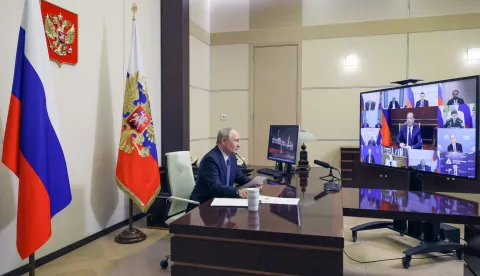 In this pool photograph distributed by the Russian state agency Sputnik, Russia's President Vladimir Putin chairs a meeting on cybersecurity with government and business members via videolink at the Novo-Ogaryovo residence outside Moscow on October 14, 2026. (Photo by Mikhail METZEL/POOL/AFP)