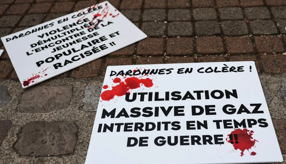 A placard which reads "Angry mothers! Mass use of teargas forbidden in wartime" is displayed during a teachers and members of staff press conference at the Lycee Paul-Eluard high school in Saint-Denis, Paris' suburb on October 16, 2026 to protest against alleged police violence that occurred during the blockade of the high school on October 15, 2026, amid a nationwide high school student protest movement over learning conditions. The Bobigny Public Prosecutor?s Office has launched an investigation into ?assaults on public officials? following a tense day of protests outside the Paul-Eluard secondary school in Saint-Denis, the prosecutor told AFP on October 16, 2026. (Photo by Anne-Christine POUJOULAT/AFP)