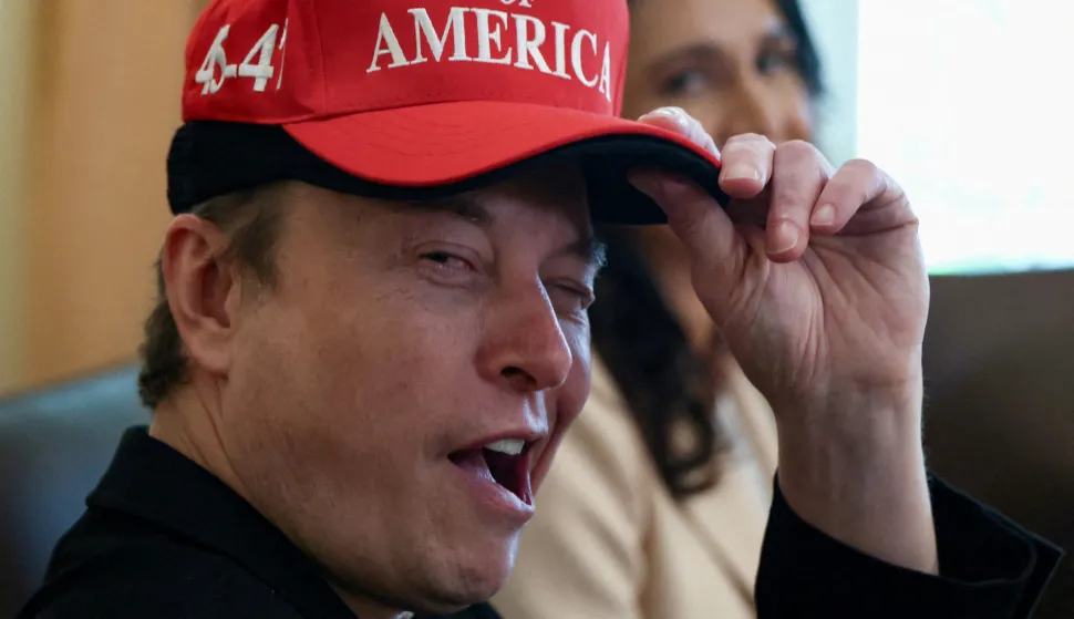 FILE PHOTO: Tesla CEO Elon Musk reacts while wearing a cap with the words "Gulf of America" as he attends a cabinet meeting held by U.S. President Donald Trump at the White House in Washington, D.C., U.S., April 30, 2025. REUTERS/Evelyn Hockstein/File Photo Photo: Evelyn Hockstein/REUTERS