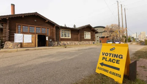A sign sits outside Bison Lodge directing people to polling location a citizens vote in a referendum to decide if Albertans want to begin the process of separating from Canada, in Edmonton, Alberta, Canada, on October 19, 2026. Alberta votes today to determine if it wants to pursue a binding referendum on leaving Canada, with Prime Minister Mark Carney warning a separatist win would bring dangerous uncertainty during a trade war with the United States. Polls indicate less than a quarter of people in the western Canadian province support independence. (Photo by Megan Albu/AFP)