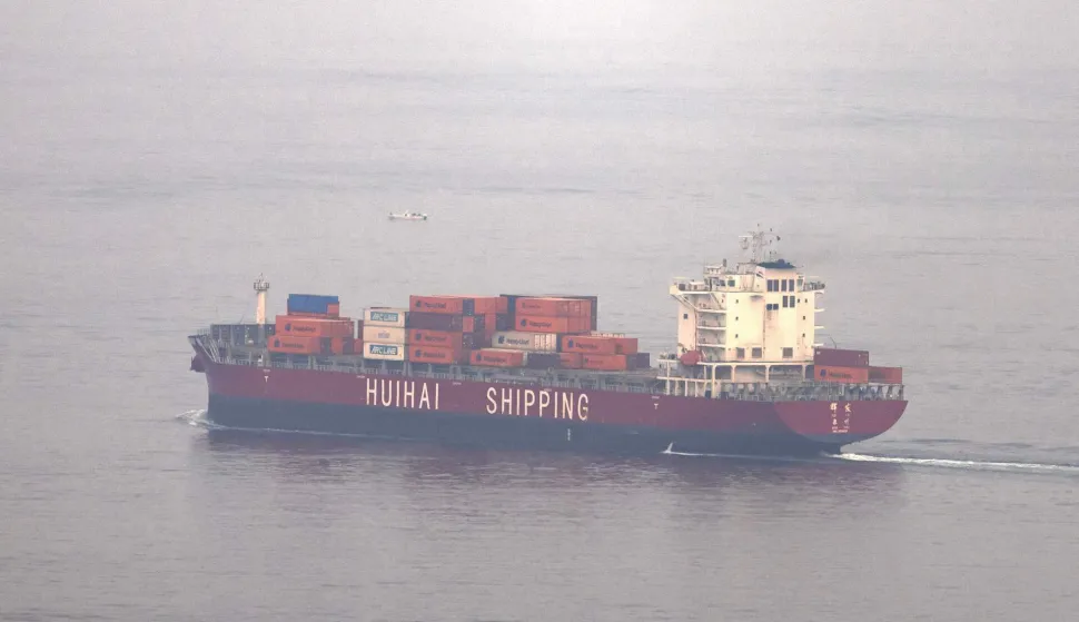 The Chinese-flagged container shipping vessel Hui Fa transits the Gulf of Oman off the coast of Khor Fakkan in the emirate of Sharjah in the east of the UAE on October 13, 2026. The International Monetary Fund (IMF) has sharply cut growth forecasts for the Middle East and Central Asia in 2026, citing "a longer closure of the Strait of Hormuz, compared with the baseline assumptions in the April" report, and predicting a major rebound in 2027 based on the expected reopening of the waterway. (Photo by AFP)