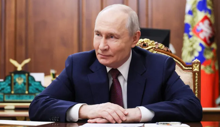 In this pool photograph distributed by the Russian state agency Sputnik, Russia's President Vladimir Putin attends a meeting with Vladivostok Mayor in Moscow on October 22, 2026. (Photo by Mikhail METZEL/POOL/AFP)