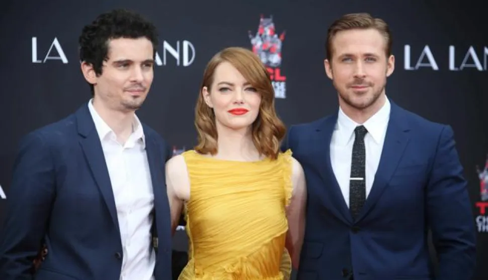 epa05746775 (FILE) A file picture dated 07 December 2016 shows US actress Emma Stone (C) and Canadian actor Ryan Gosling (R) as they pose with US director Damien Chazelle (L) during a hand and footprint ceremony honoring Stone and Gosling at the TCL Chinese Theatre in Hollywood, California, USA. The movie 'La La Land' by Damien Chazelle leads the Oscar nominations with 14 nods for, among others, Best Film, Best Director for Damien Chazelle, Best Actor for Ryan Gosling, Best Actress for Emma Stone. EPA/MIKE NELSON