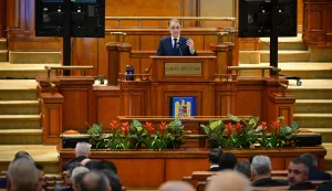 Romania's prime minister-designate Luca Niculescu (C) gives a speech at the Romanian Parliament in Bucharest during a plenary session on October 20, 2026. The 55-year-old diplomat and former ambassador is attempting to form a hybrid administration composed of the centre-left Social Democratic Party (PSD) and independent technocrats. The vote aims to end a damaging five-month political deadlock that has frozen key economic decisions and strained investor confidence in the EU and NATO member state.Niculescu is the fourth candidate to try and form a government since a pro-European coalition government collapsed in May, sparking uncertainty. (Photo by Daniel MIHALESCU/AFP)