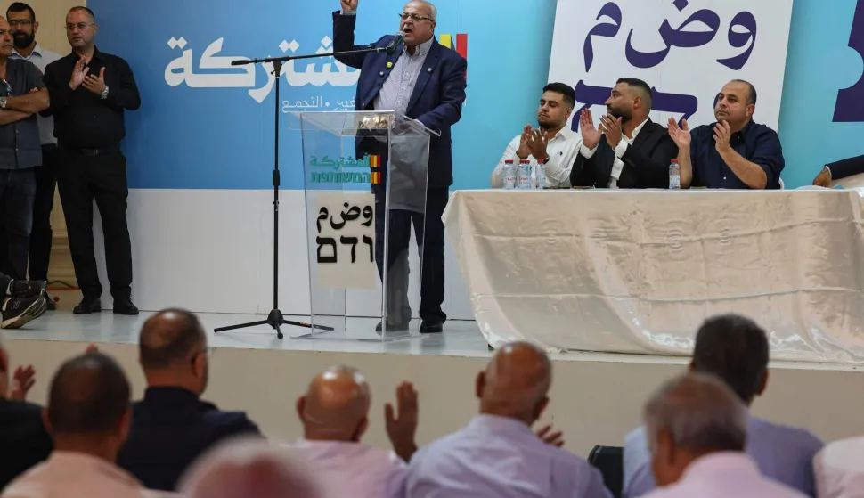 Arab-Israeli lawmaker Ahmad Tibi speaks to supporters during a meeting of the Arab-led Joint List party as part of the campaign ahead of Israel's legislative election, in Ara in northern Israel on October 23, 2026. Israel heads to the polls on October 27 in its first election since the October 7, 2023 Hamas-led attack, in what is seen as a referendum on the prime minister. (Photo by Ahmad GHARABLI/AFP)