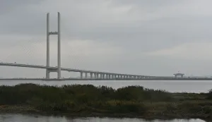 A general view shows the new cross-border bridge linking China and North Korea in Dandong, Liaoning Province, on October 15, 2026. A new four-lane road bridge linking China and North Korea finally opened on October 15, 12 years late, enabling the Asian giant and its isolated nuclear-armed neighbour to step up cross-border trade substantially. (Photo by Michael ZHANG/AFP)